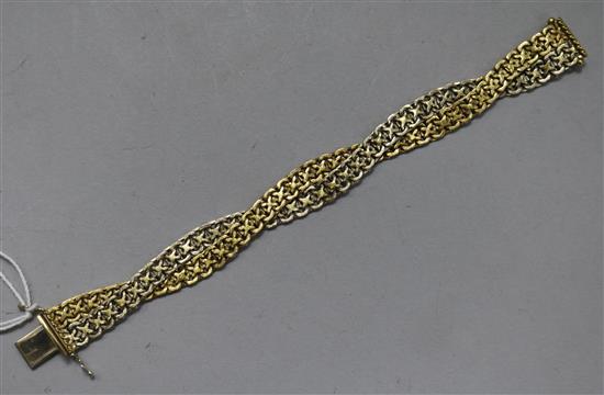 An Italian 18ct two colour gold interwoven bracelet, 39.2 grams.